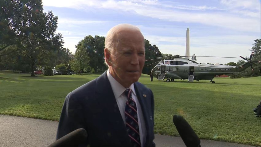 President Joe Biden stops to talk to reporters before leaving