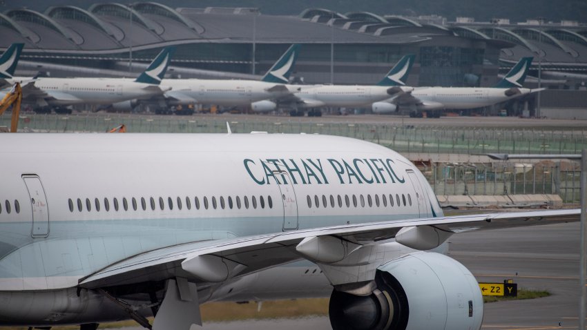 FILE – A Cathay Pacific airplane taxis at Hong Kong International Airport in Hong Kong on Nov. 25, 2022.