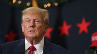 Republican presidential candidate and former U.S. President Donald Trump looks on during a campaign event on December 19, 2023 in Waterloo, Iowa.