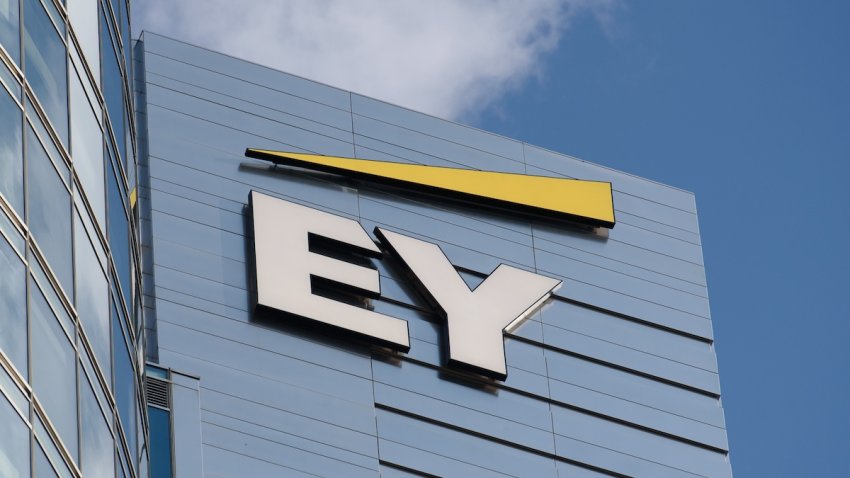 Ernst & Young signage is being pictured on a building in Warsaw, Poland, on July 8, 2024.