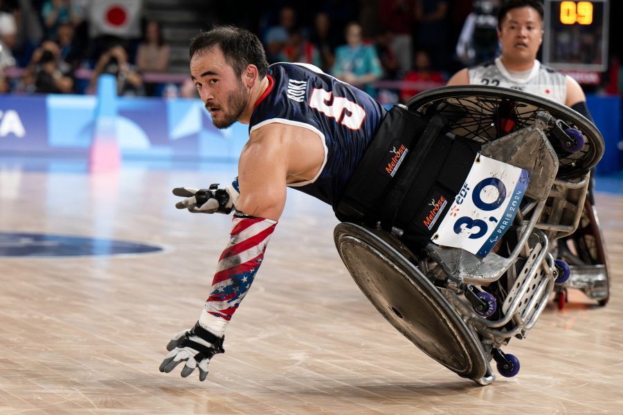 Team USA's Chuck Aoki passes the ball as he competes in the final match of the Open Wheelchair Rugby during the Paris 2024 Paralympics at the Champ de Mars Arena in Paris on September 2 2024