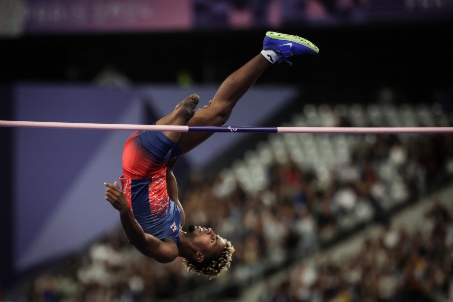 Dominican Republic's Wagner Astacio competes in the men's high jump T63 event during the Paris 2024 Paralympic Games at Stade de France in Saint-Denis France on September 3 2024