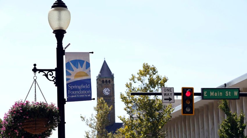 A sign hangs from a street light at the intersection of Main Street and Fountain Avenue in Springfield, Ohio, Wednesday, Sept. 11, 2024.