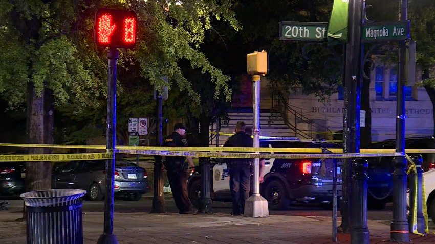 Police stand by yellow tape following a mass shooting in Birmingham