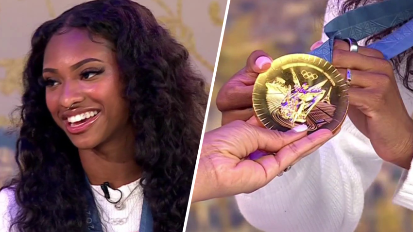 Masai Russell shows off her gold medal in the News4 studio.