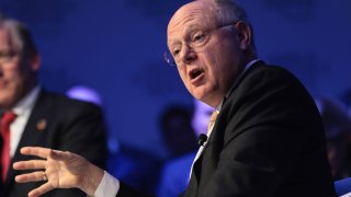 Ian Read, chairman and chief executive officer of Pfizer Inc., gestures as he speaks during a panel session at the World Economic Forum (WEF) in Davos, Switzerland, on Tuesday, Jan. 17, 2017.