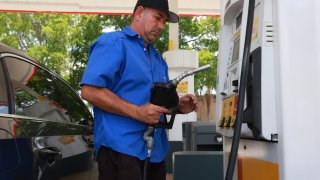 A customer gets gas at a Shell station on May 15, 2024 in Miami, Florida.