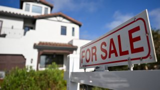 A for sale sign is displayed outside of a home for sale on August 16, 2024 in Los Angeles, California.