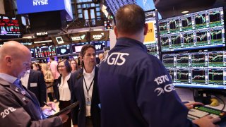 Traders work on the floor of the New York Stock Exchange during morning trading in New York City. 