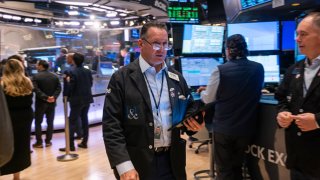 NEW YORK, NEW YORK – OCTOBER 16: Traders and others work on the New York Stock Exchange (NYSE) floor in New York City. 