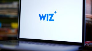 The Wiz logo on a laptop.