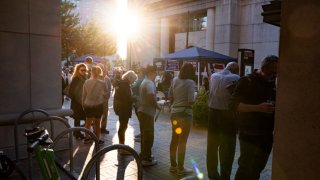 Voters wanting to cast an early vote line up outside the Elena Bozeman Government Center for a polling station to open in Arlington, Virginia, on September 20, 2024. 