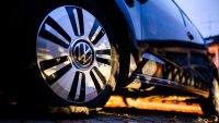 A Volkswagen logo on the rim of an e-up. electric car tire.