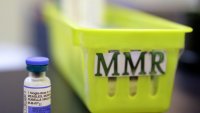 FILE – A vial of a measles, mumps and rubella vaccine sits on a countertop at a pediatrics clinic in Greenbrae, Calif., on Feb. 6, 2015.