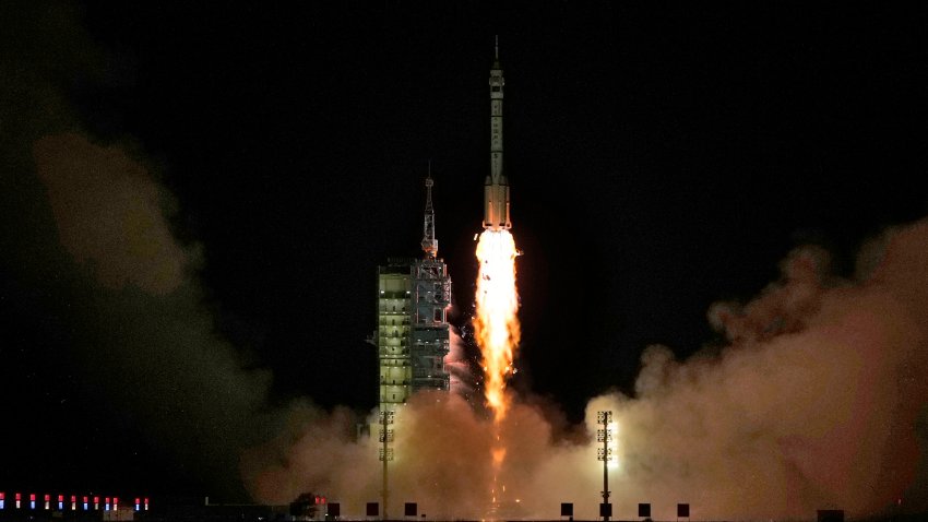 A Long March rocket with a Shenzhou-19 spacecraft atop takes off.