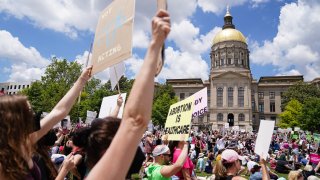 File - Activists rally outside the State Capitol in support of abortion rights in Atlanta on May 14, 2022.