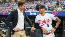 MINNEAPOLIS, MN - SEPTEMBER 22: Executive chair Joe Pohlad of the Minnesota Twins looks on with Carlos Correa #4 against the Los Angeles Angels on September 22, 2023 at Target Field in Minneapolis, Minnesota. (Photo by Brace Hemmelgarn/Minnesota Twins/Getty Images)