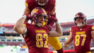 LANDOVER, MARYLAND – OCTOBER 20: Ben Sinnott #82 of the Washington Commanders celebrates with teammates after scoring a touchdown against the Carolina Panthers during the third quarter at Northwest Stadium on October 20, 2024 in Landover, Maryland. (Photo by Patrick Smith/Getty Images)