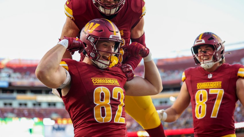 LANDOVER, MARYLAND – OCTOBER 20: Ben Sinnott #82 of the Washington Commanders celebrates with teammates after scoring a touchdown against the Carolina Panthers during the third quarter at Northwest Stadium on October 20, 2024 in Landover, Maryland. (Photo by Patrick Smith/Getty Images)