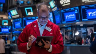 Traders work on the floor of the New York Stock Exchange (NYSE) on October 22, 2024 in New York City.