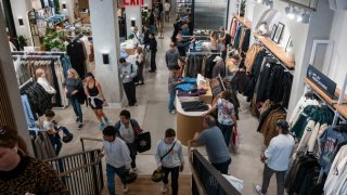 People shop in an Abercrombie & Fitch store in midtown Manhattan on October 24, 2024 in New York City. 