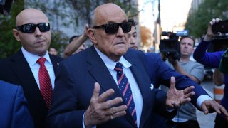 Rudy Giuliani (C) arrives at the New York court following a judge’s order compelling his appearance in the defamation case filed by Georgia election workers in New York, United States on November 07, 2024. 