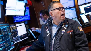 Traders work on the floor of the New York Stock Exchange. 