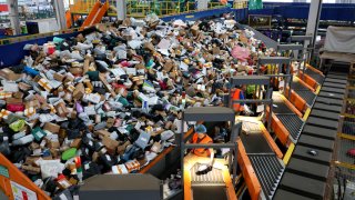 Staff sort express deliveries at China Post’s Zaozhuang branch in east China’s Shandong province on November 10, 2024