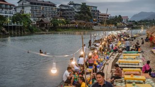 Vang Vieng, Laos, is a popular stop for backpackers in Asia.