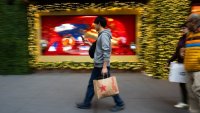 Shoppers carry their purchases on Black Friday in New York City on November 29, 2024. 