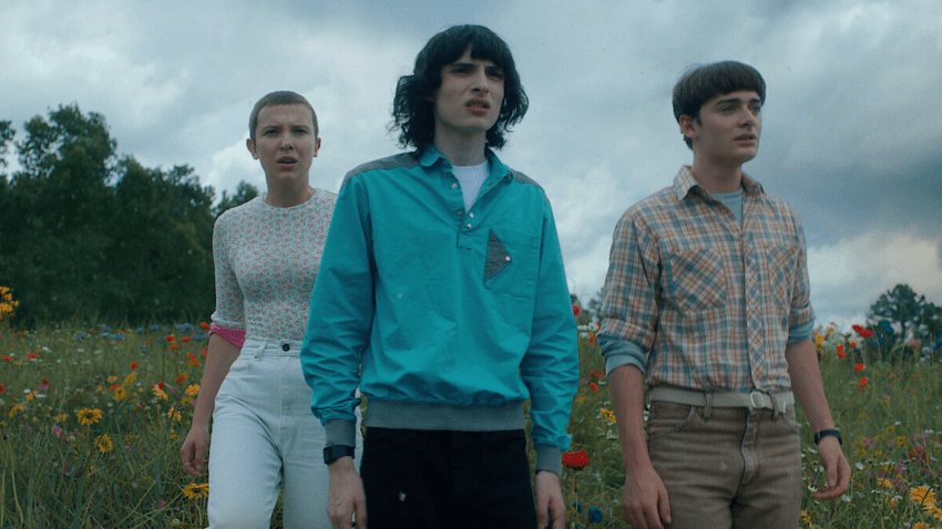 Millie Bobby Brown, Finn Wolfhard and Noah Schnapp in character while filming "Stranger Things."