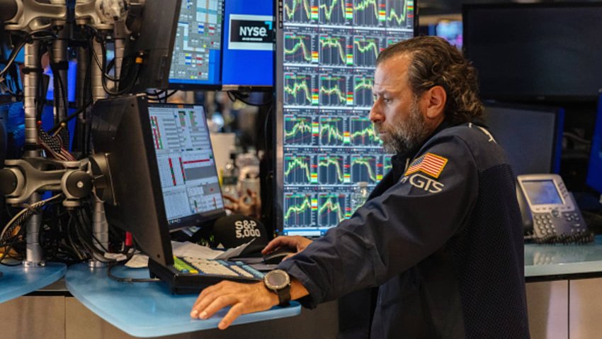 Traders work on the floor of the New York Stock Exchange on Aug. 1, 2024.