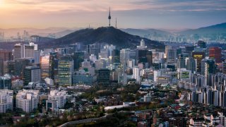 Sunrise scene of Seoul downtown city skyline, Aerial view of N Seoul Tower at Namsan Park in twilight sky in morning. The best viewpoint and trekking from inwangsan mountain in Seoul city, South Korea