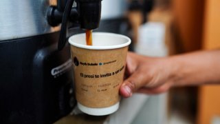 A coffee cup with a printed message from Salvadoran President Nayib Bukele’s X account is pictured at Franco’s Pupusa restaurant in San Salvador on July 17, 2024.