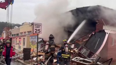 ‘I felt the boom': Burning building collapses in DC after car crash