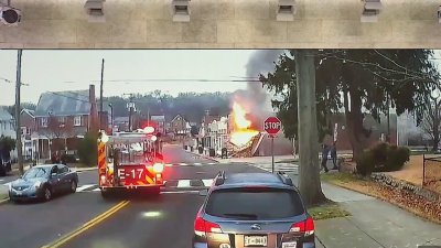 Dashcam video shows firefighters rushing to DC building collapse, fire