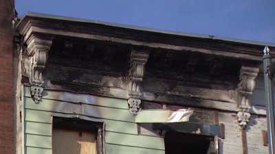 Row houses boarded up after catching on fire in Shaw