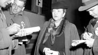 Former Secretary of Labor Frances Perkins chats with reporters in New York, Nov. 27, 1945