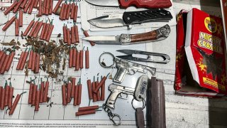 In Terminal 4 at LAX, a TSA officer flagged a carry-on bag with 82 consumer grade fireworks, three knives, two replica firearms and one canister of pepper spray.