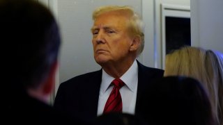 U.S. President Donald Trump looks on as he speaks to reporters aboard Air Force One before arriving at Joint Base Andrews, Maryland, U.S., Jan. 27, 2025. 