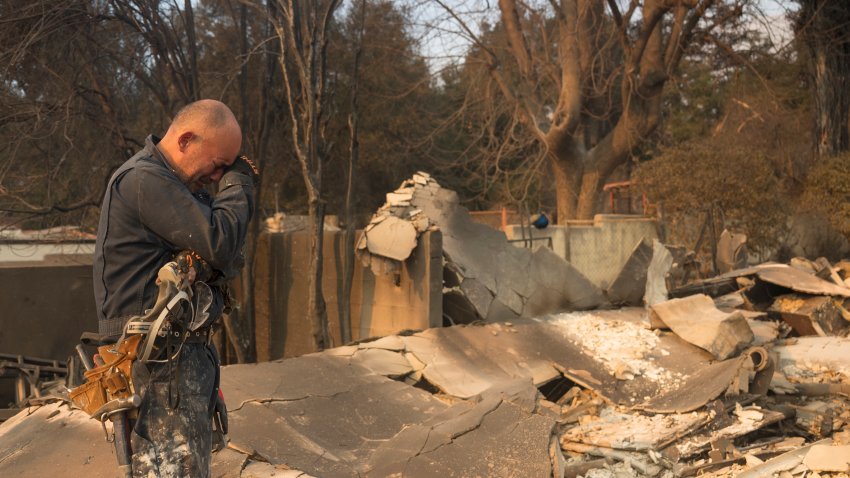 FILE - Cesar Plaza becomes emotional while looking at his home destroyed by the Eaton Fire in Altadena, Calif., Thursday, Jan. 9, 2025.