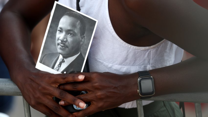 A civil rights supporter holds a photo of Martin Luther King Jr. as they attend the 60th Anniversary Of The March On Washington at the Lincoln Memorial on August 26, 2023 in Washington, DC. The march commemorates the 60th anniversary of Dr, Martin Luther King Jr.’s “I Have a Dream” speech and the 1963 March on Washington for Jobs and Freedom where more than a quarter million people marched on the National Mall for civil rights. (Photo by Kevin Dietsch/Getty Images)