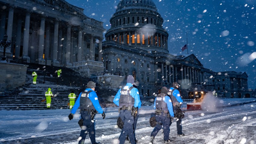 Law enforcement officers outside the US Capitol in Washington, DC, US, on Monday, Jan. 6, 2025. Snow is piling up in Washington, shutting down federal offices and schools, as a winter storm that has snarled air and road traffic and knocked out power in six states makes its way east. Photographer: Kent Nishimura/Bloomberg via Getty Images