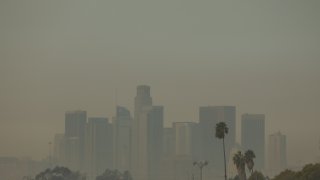 Wildfire smoke from the Palisades and Eaton fires blankets a view of downtown Los Angeles