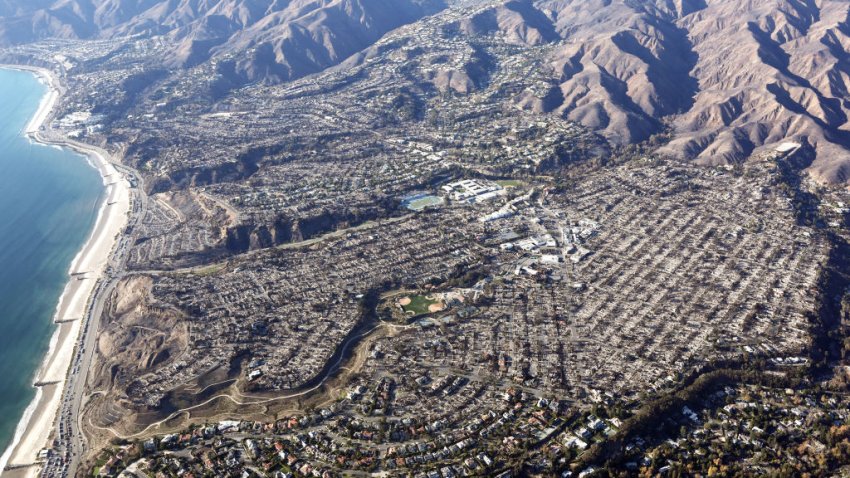 An aerial view of homes destroyed in the Palisades Fire as wildfires cause damage and loss through the LA region on January 13, 2025 in Pacific Palisades, California.