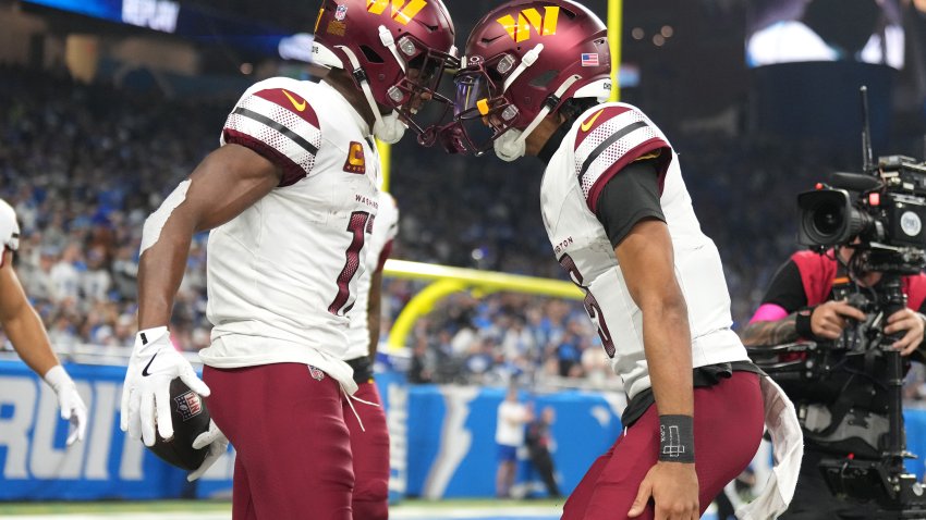 Terry McLaurin celebrates with Jayden Daniels after catching a pass for a touchdown.