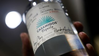 A seller holds up a bottle of Casamigos, tequila from Diageo, the world’s leading spirits maker, at a liquor store in Monterrey, Mexico, on Dec. 10, 2024.
