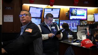 Traders work on the floor at the New York Stock Exchange (NYSE) in New York City, U.S., February 12, 2025. 