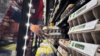 A worker stocks eggs at a grocery store in Washington, D.C., on Feb. 12, 2025.