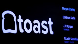 A screen displays the company logo for Toast Inc. during the company’s initial public offering at the New York Stock Exchange in New York City on Sept. 22, 2021.